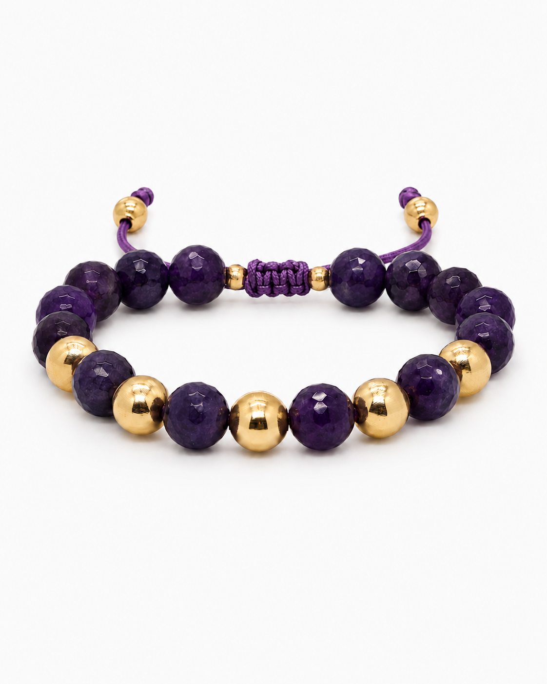 Purple and gold beaded bracelet on a white background