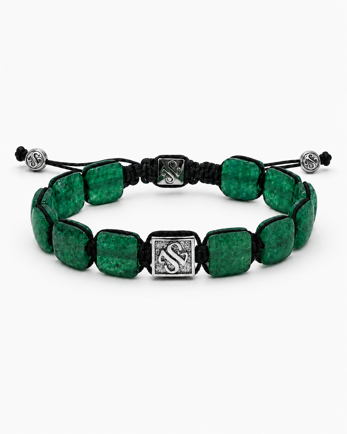 Green beaded bracelet with a white gold clasp on a white background