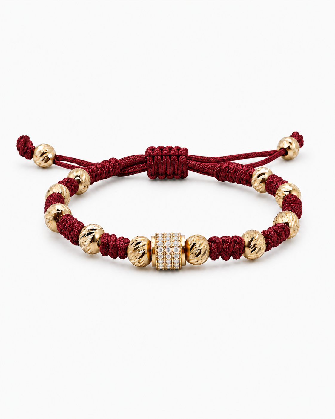 Bracelet with gold beads and a red cord on a white background #Color_Burgundy