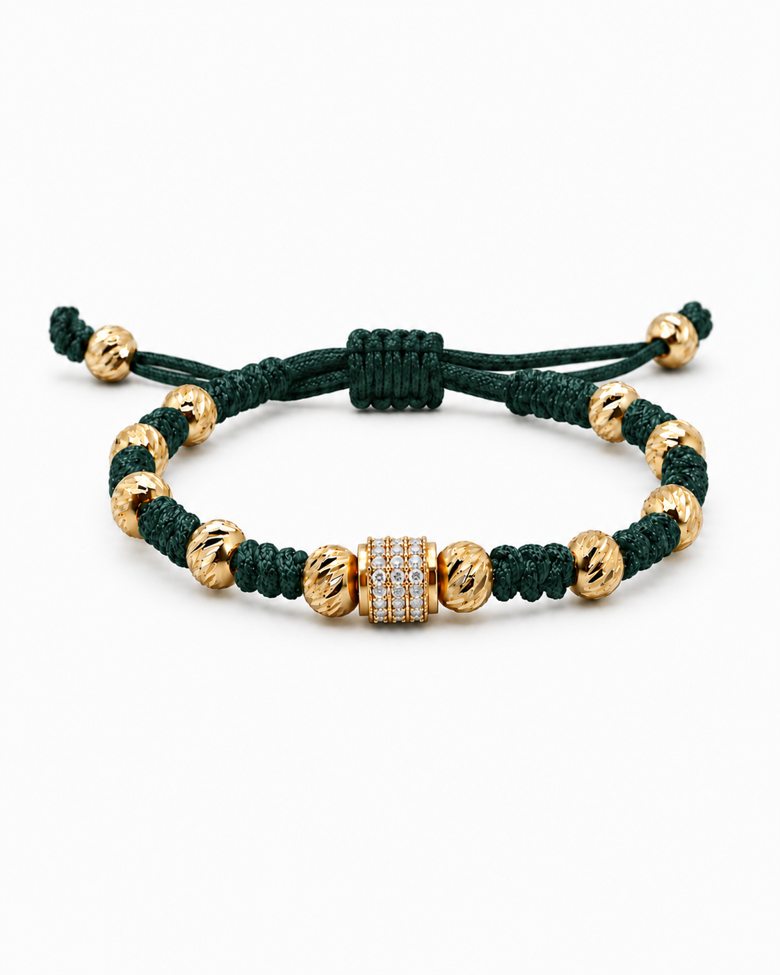 Green and gold bracelet on a white background #Color_Emerald