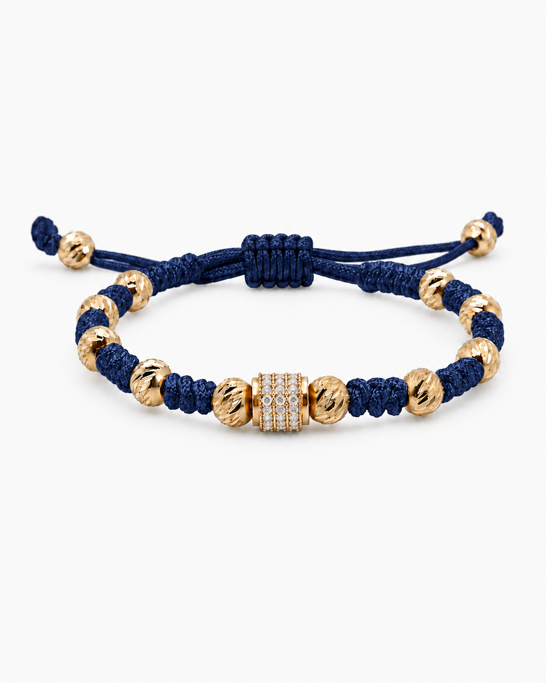 Navy blue bracelet with gold beads on a white background