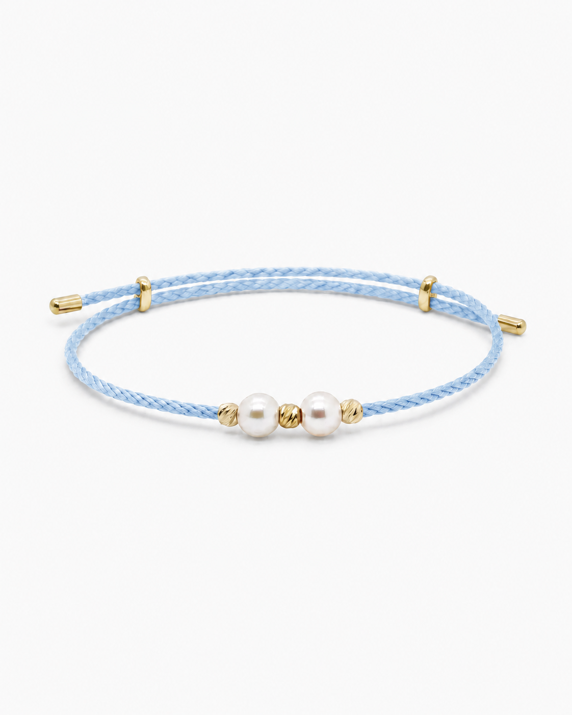 Light blue woven bracelet with gold accents and pearls on a white background #Color_