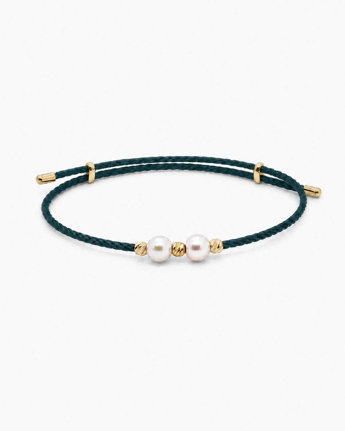 Green bracelet with pearls and gold accents on a white background #Color_