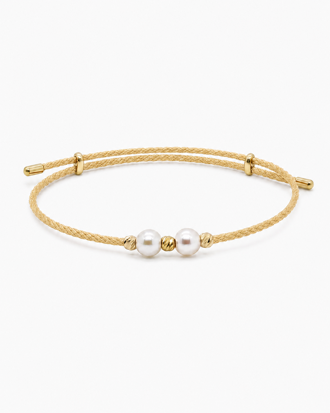 Gold bracelet with two pearls on a white background #Color_