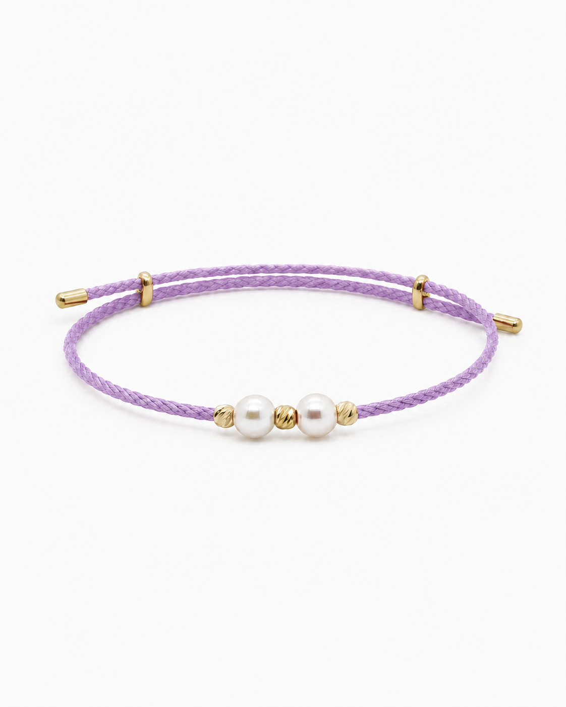 Purple bracelet with pearls and gold accents on a white background #Color_