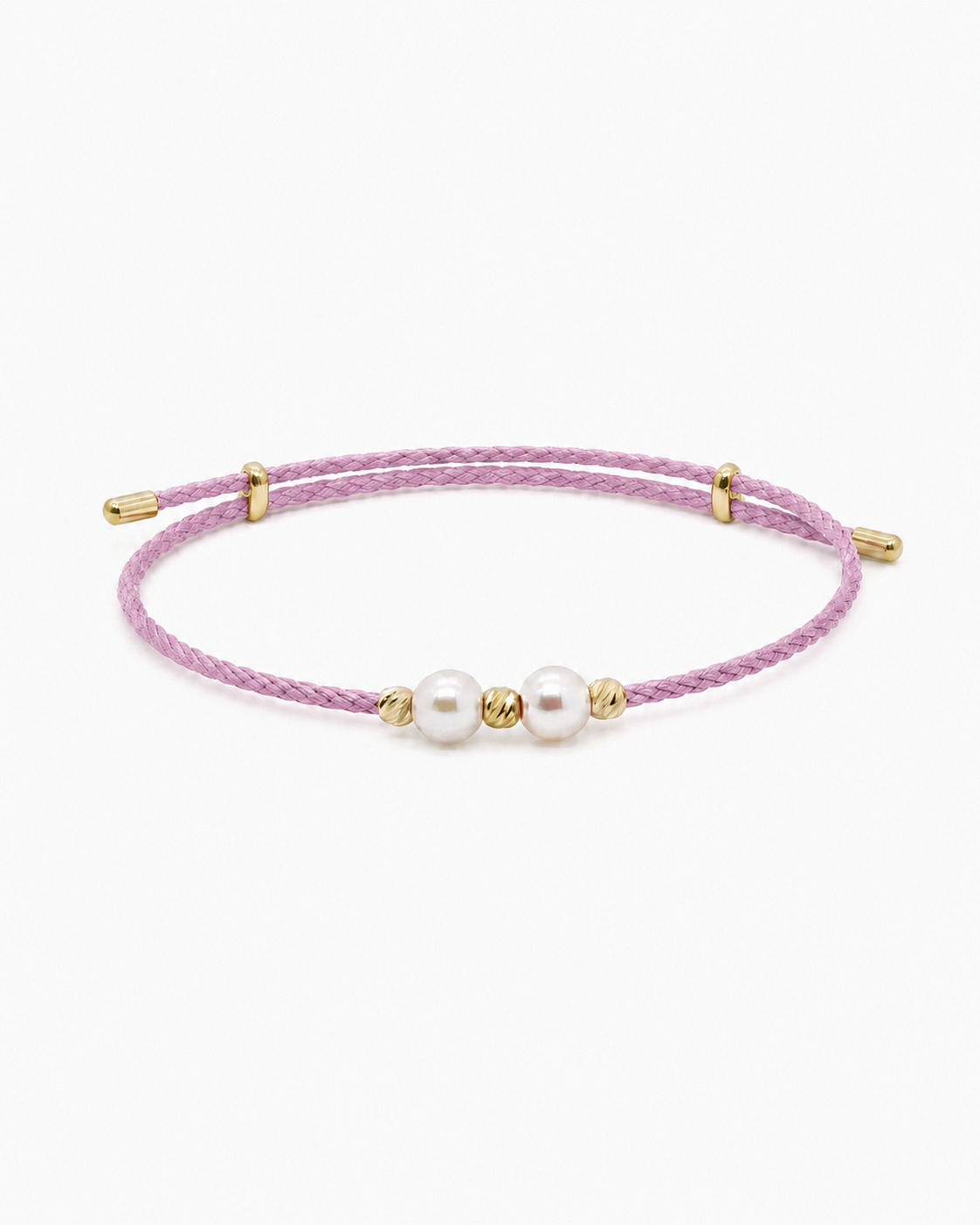 Pink bracelet with pearls and gold accents on a white background #Color_