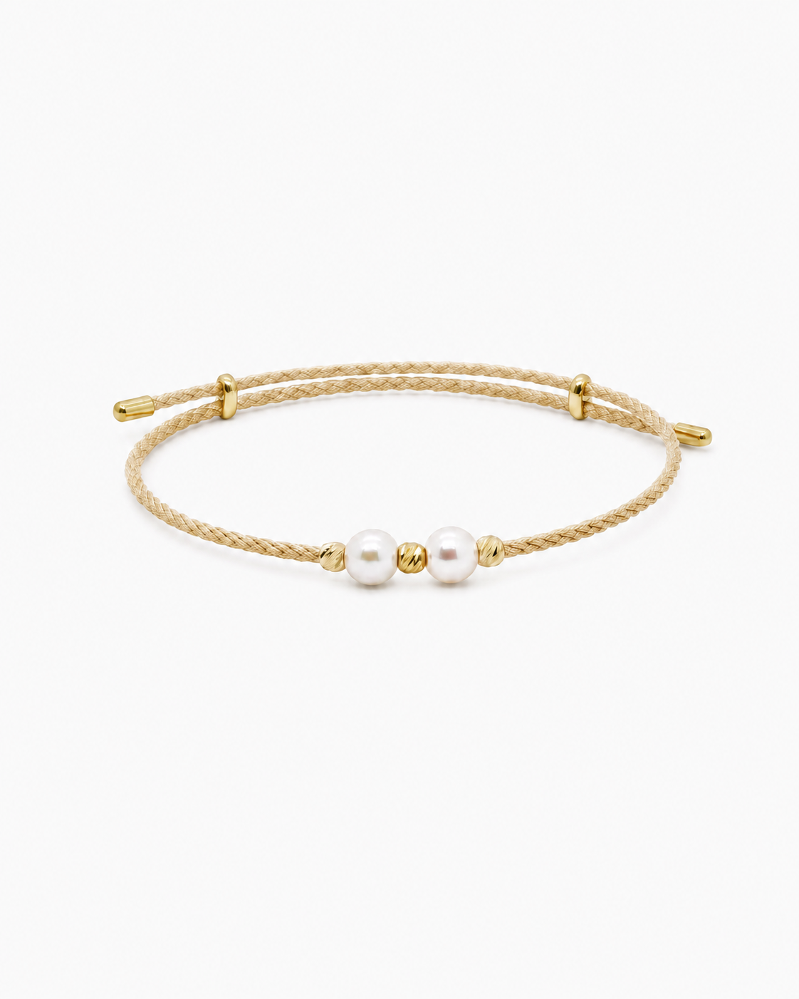 Gold bracelet with two pearls on a white background #Color_