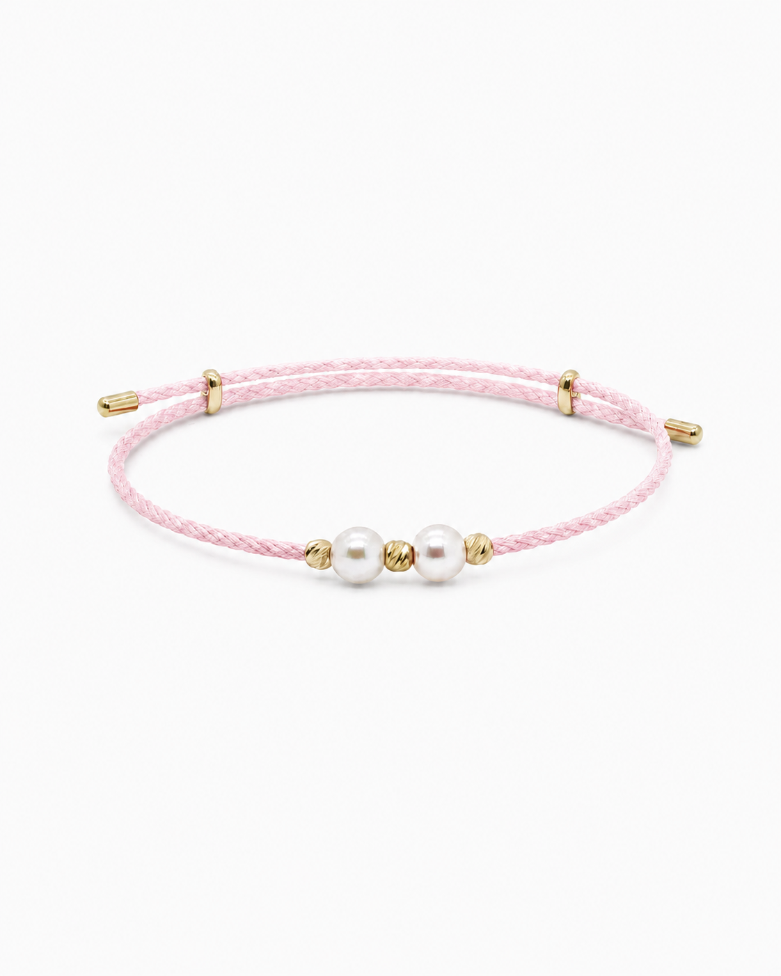 Pink bracelet with gold accents and pearls on a white background #Color_