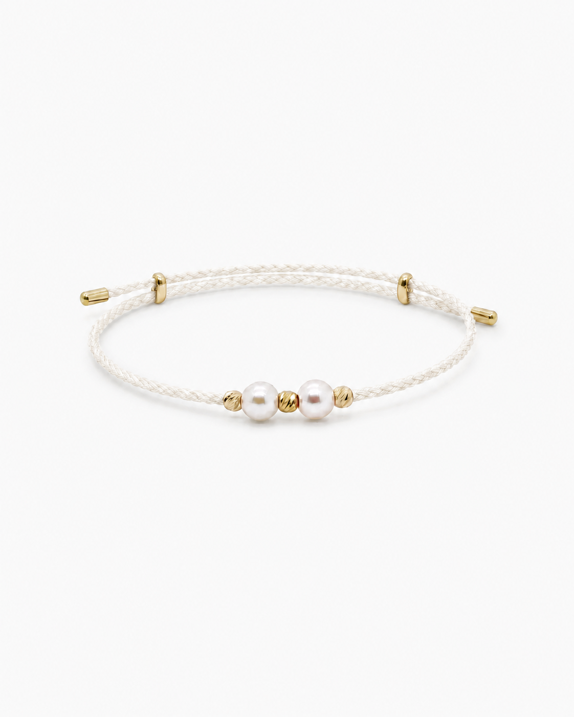 White pearl bracelet with gold accents on a white background #Color_