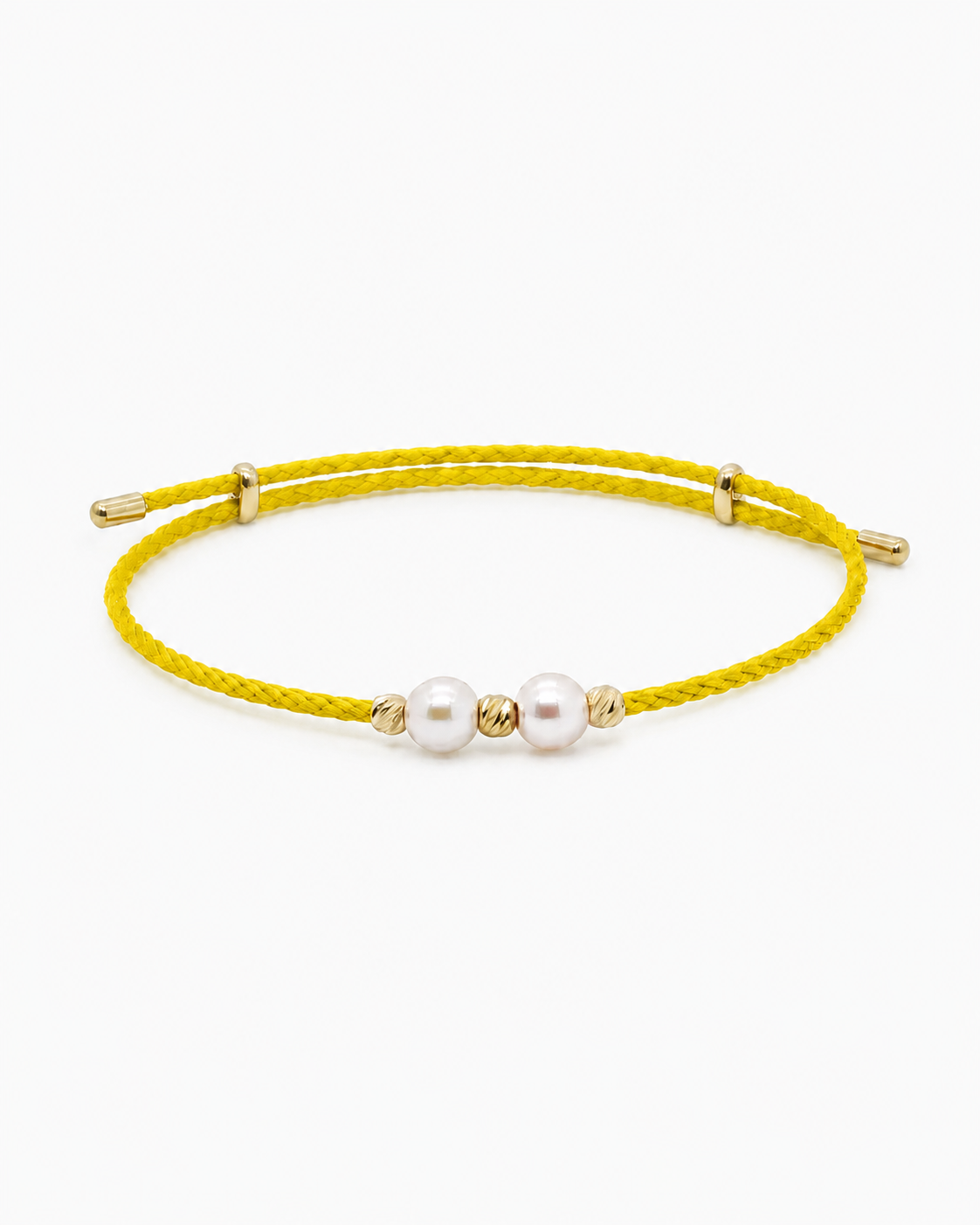 Yellow bracelet with two pearls on a white background #Color_