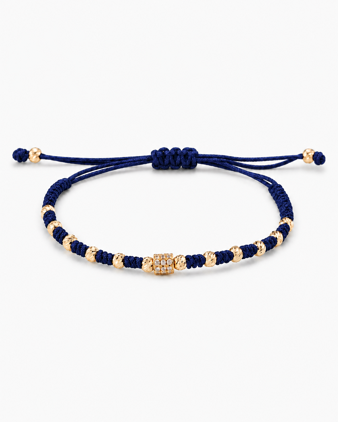 Navy blue bracelet with gold beads on a white background