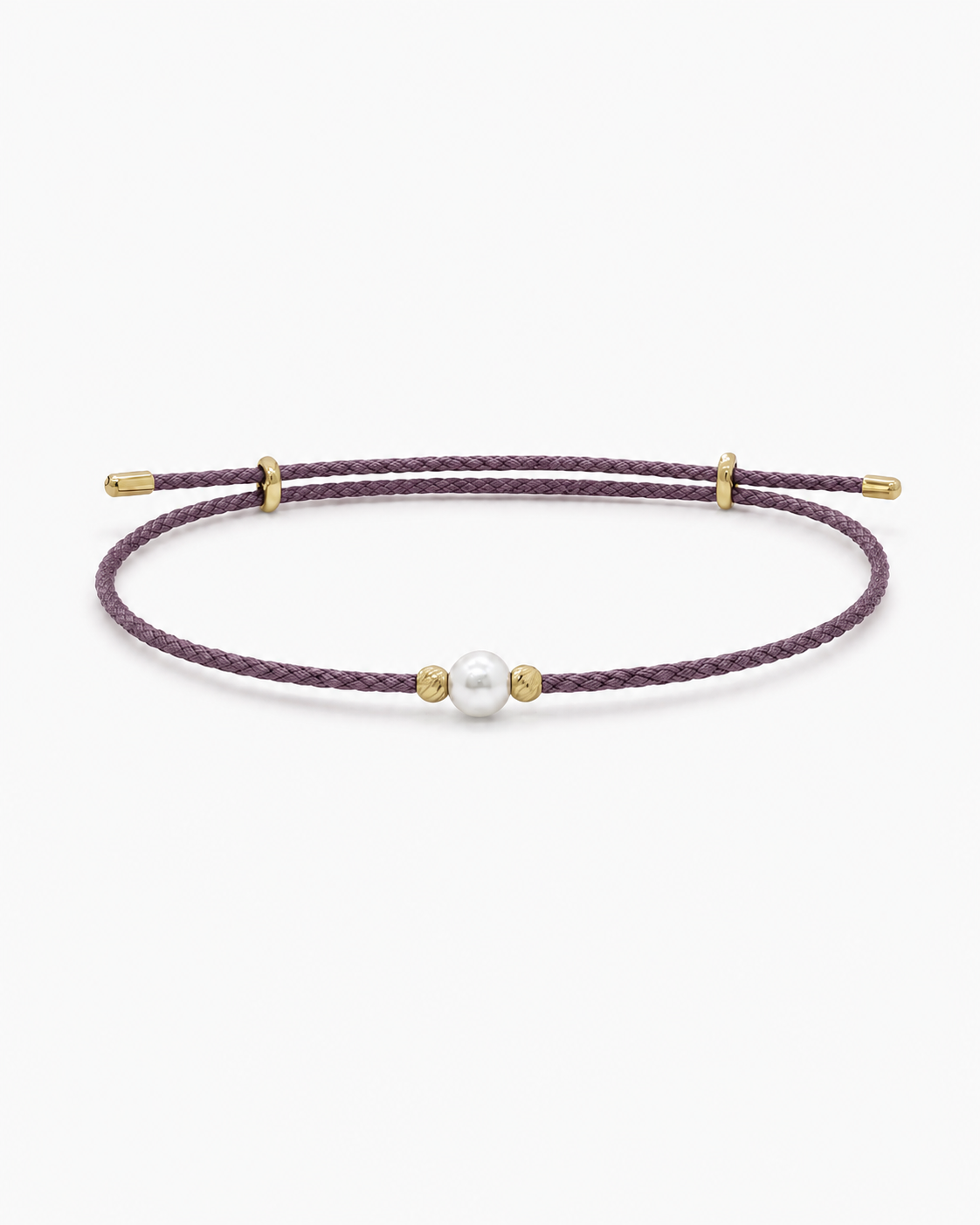 Purple cord bracelet with a pearl and gold accents on a white background #Color_