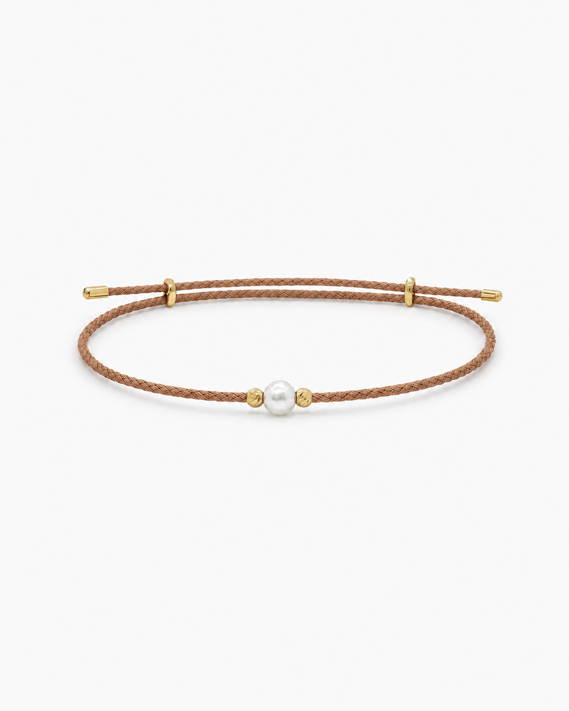 Bracelet with a pearl and gold accents on a brown cord against a white background #Color_