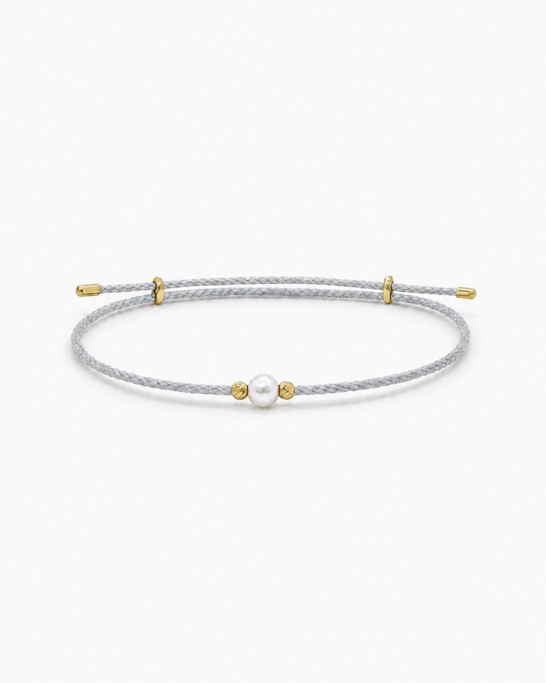 Bracelet with a pearl and gold accents on a white background #Color_