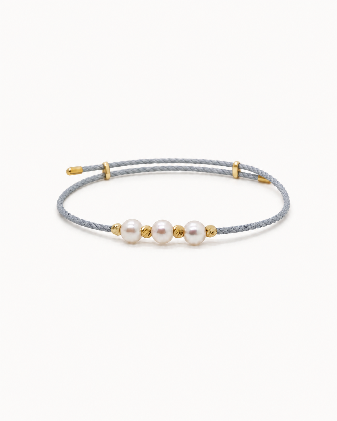 Gray cord bracelet with three pearls and gold accents on a white background #Color_Grey