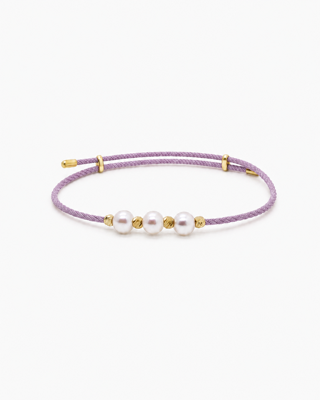 Purple bracelet with pearls and gold accents on a white background #Color_Lilac