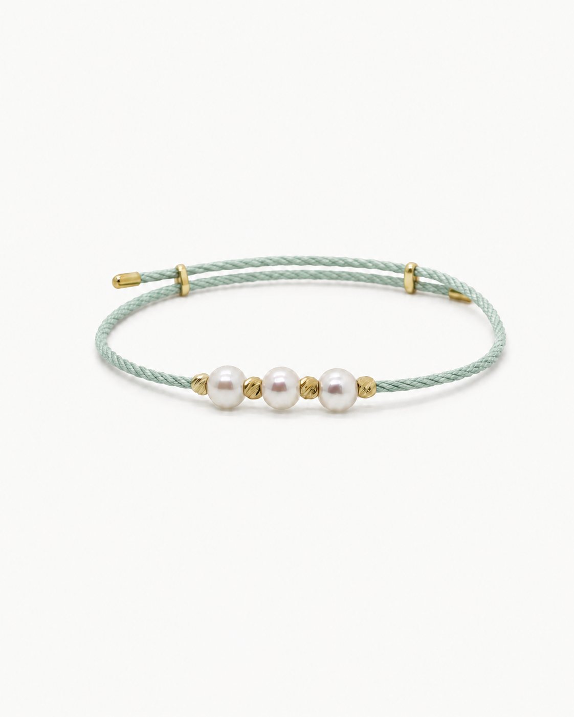 Bracelet with three pearls on a thin cord against a white background #Color_Lime Green