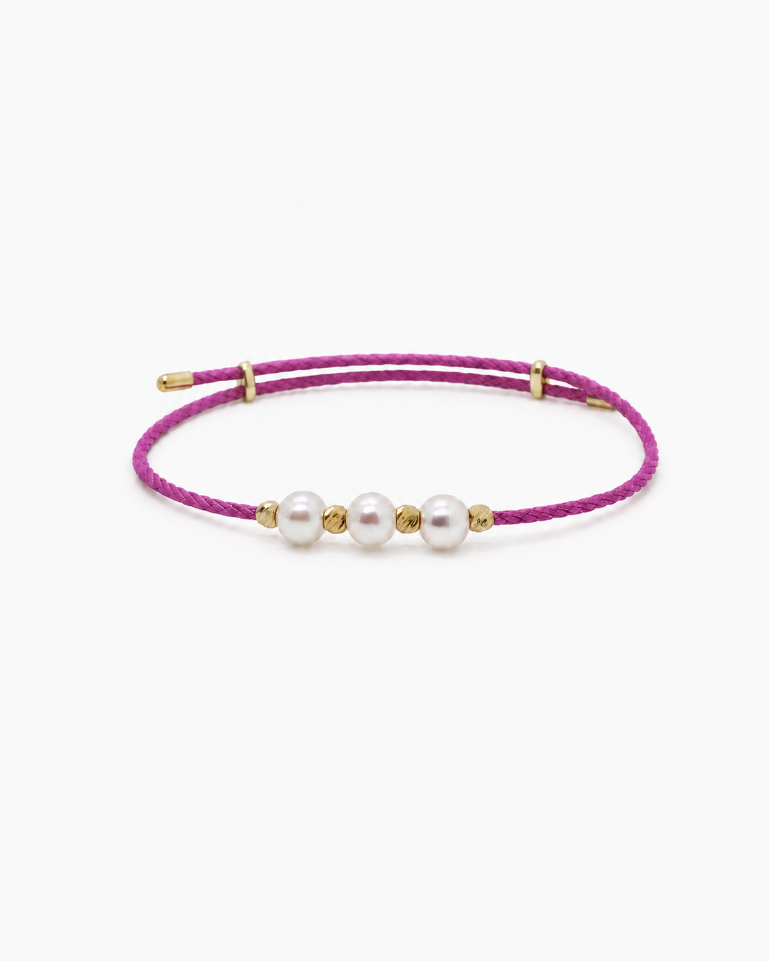 Pink bracelet with gold accents and pearls on a white background #Color_Magenta