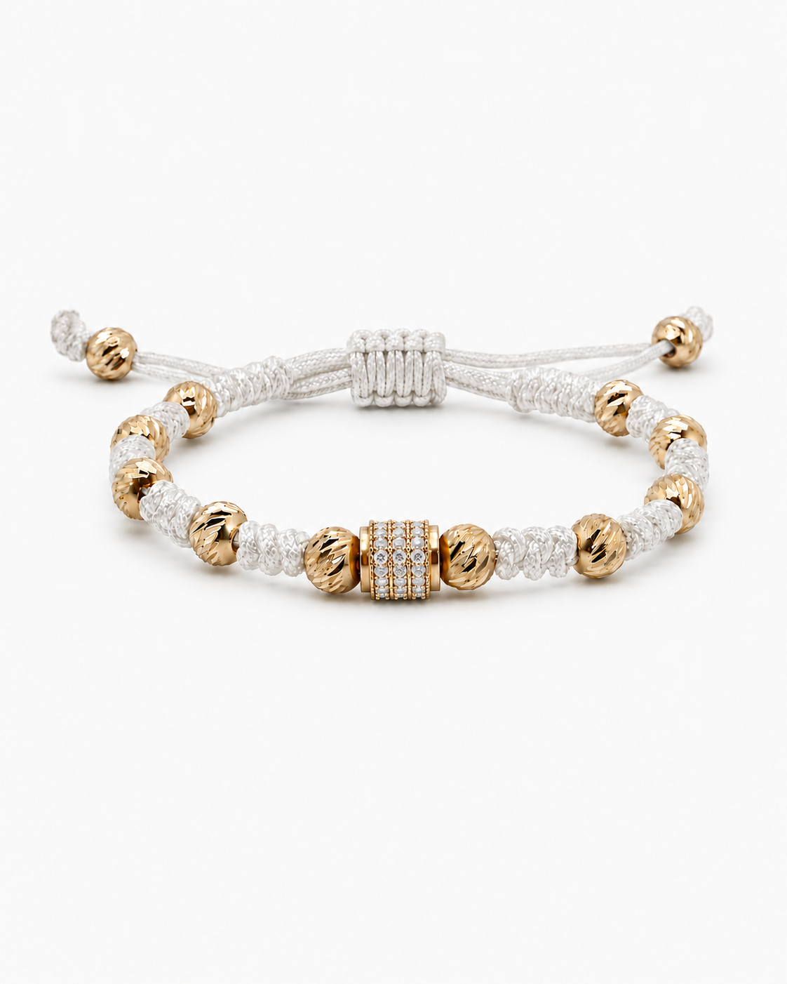 Bracelet with gold and white beads on a white background