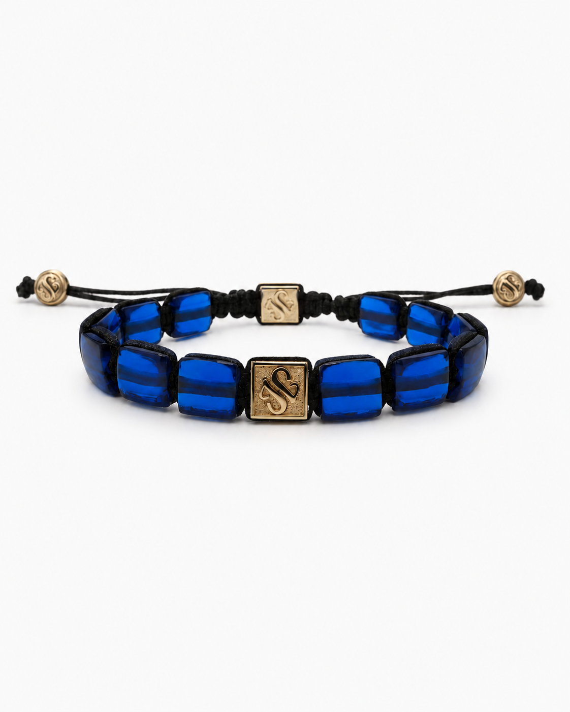 Blue beaded bracelet with gold accents on a white background