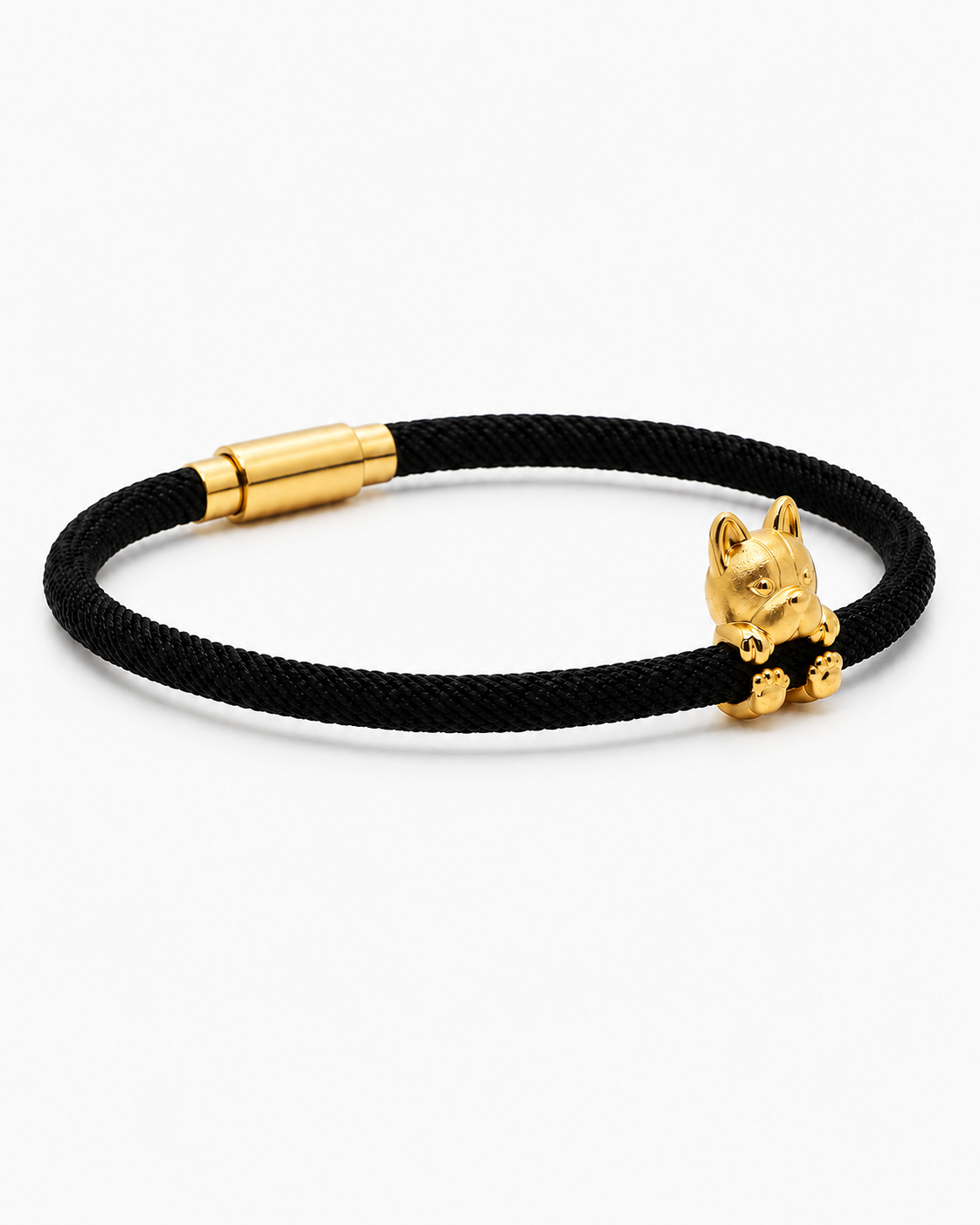 Black cord bracelet with a gold cat-shaped charm on a white background