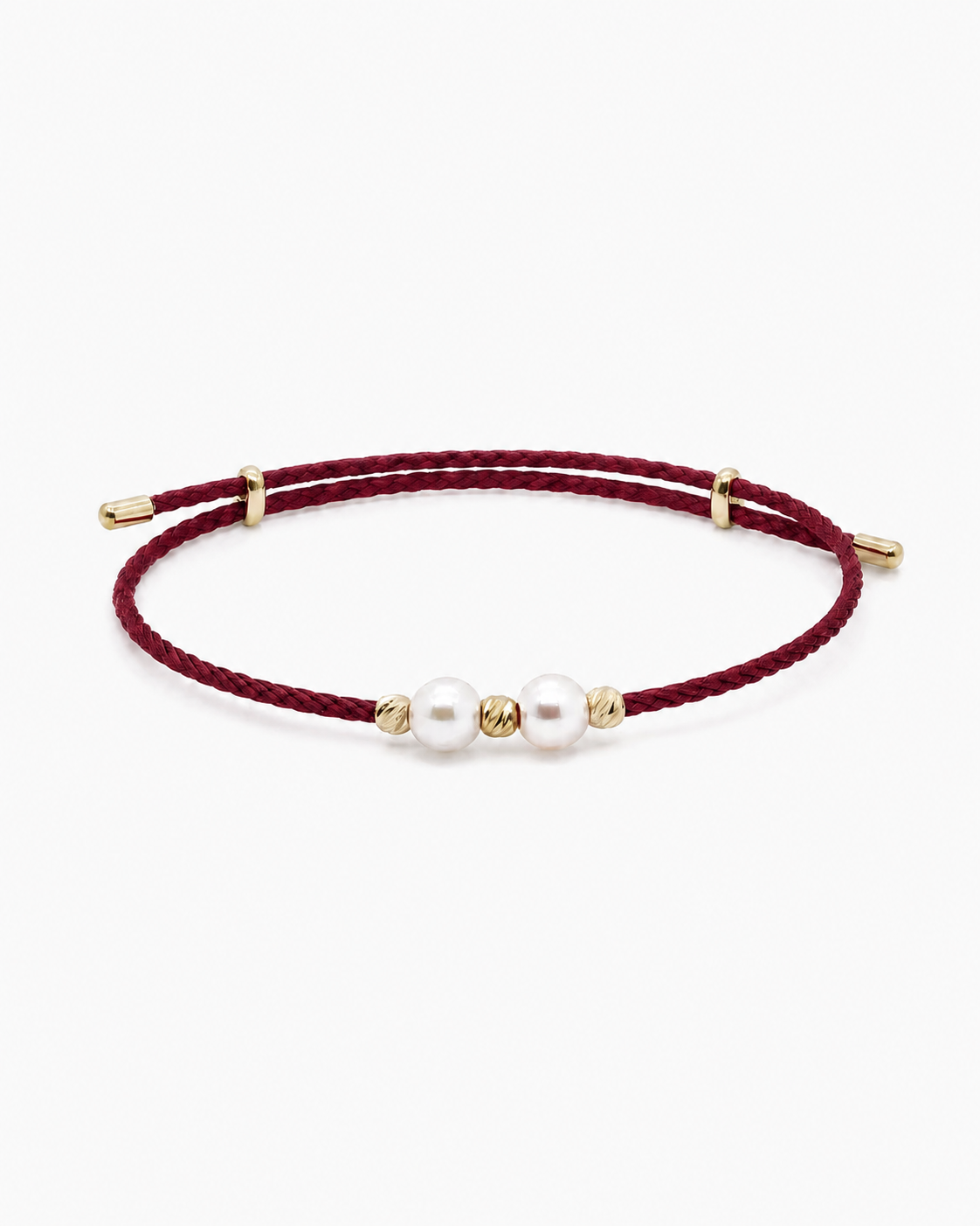 Burgundy cord bracelet with pearls and gold accents on a white background #Color_