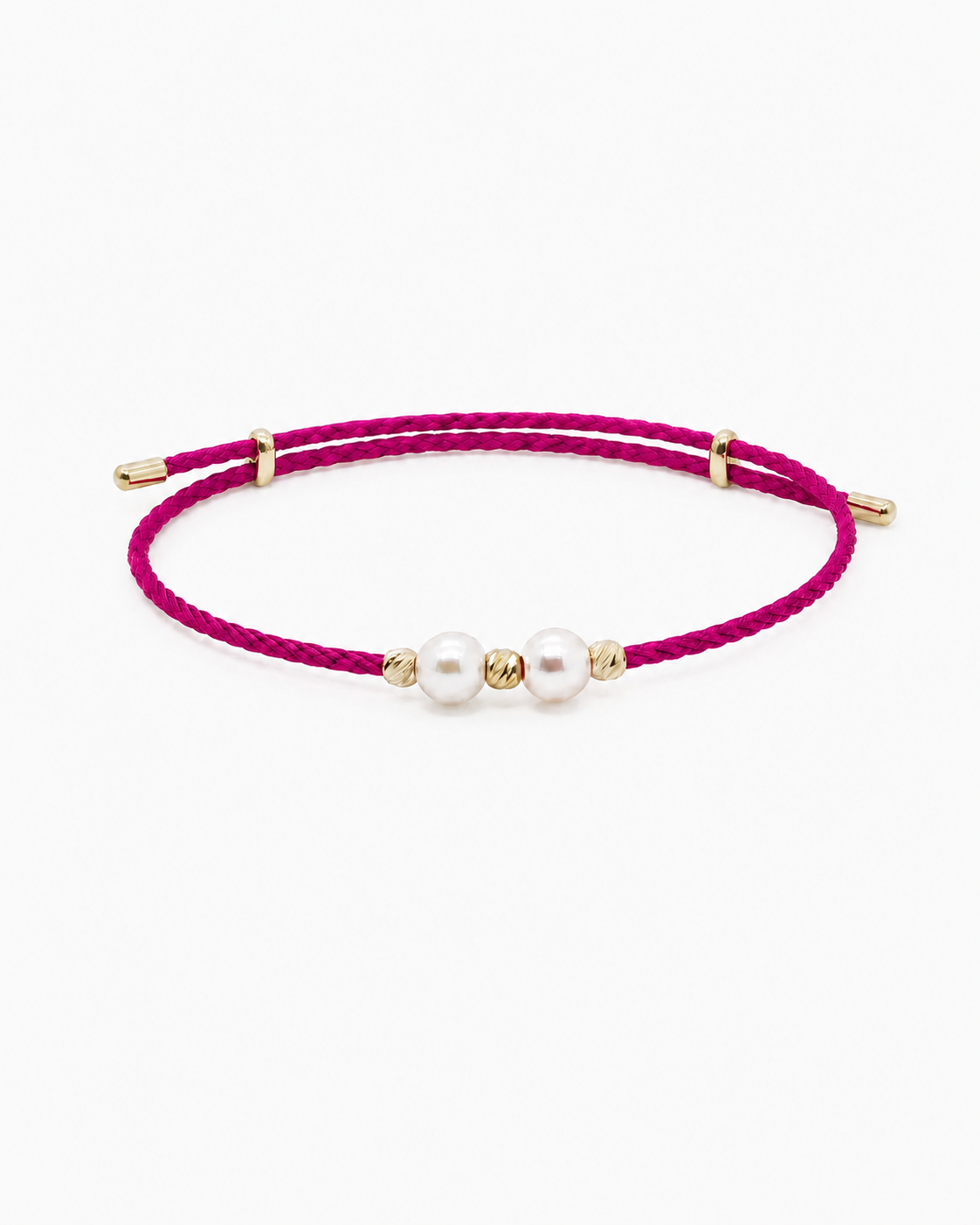 Pink bracelet with pearls and gold accents on a white background #Color_