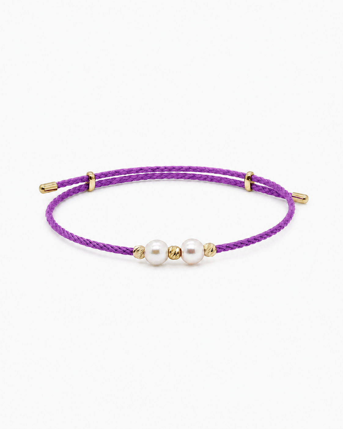 Purple bracelet with gold accents and pearls on a white background #Color_