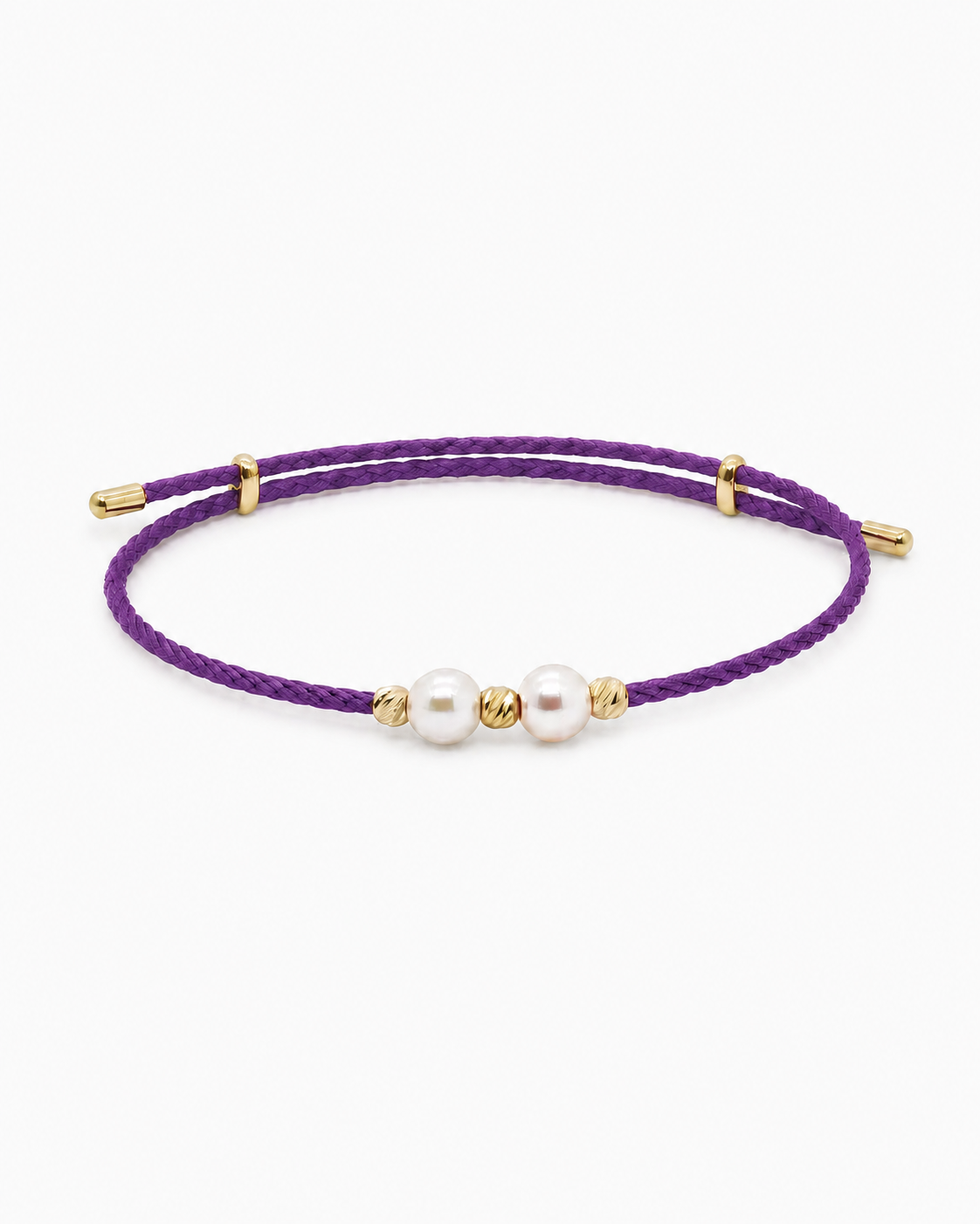 Purple bracelet with gold accents and pearls on a white background #Color_