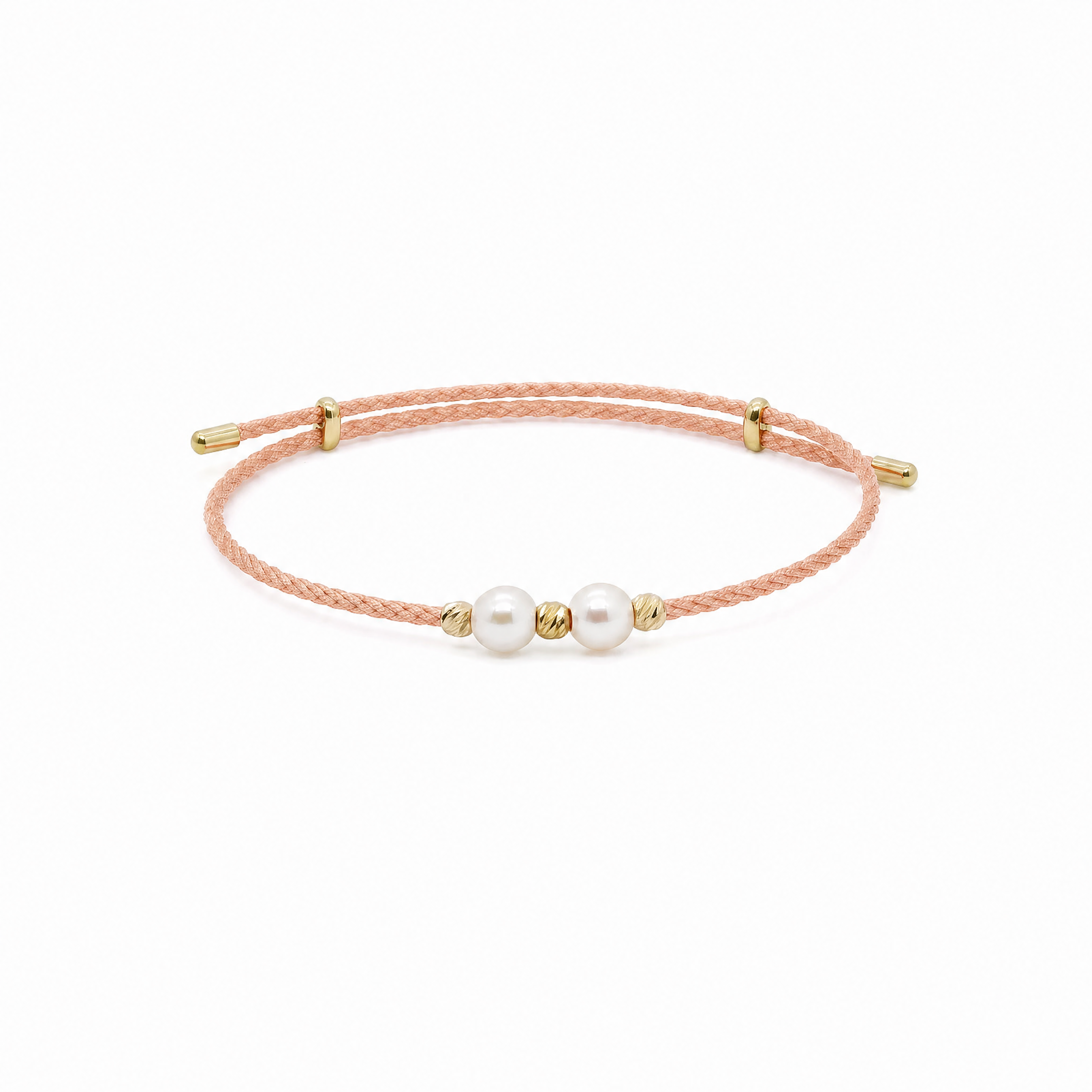 Bracelet with pink cord and gold beads on a white background #Color_