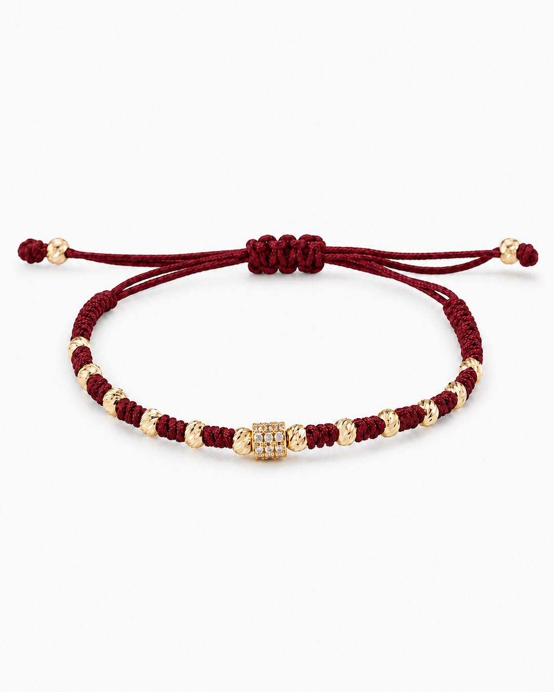 Bracelet with red cord and gold beads on a white background #Color_Burgundy