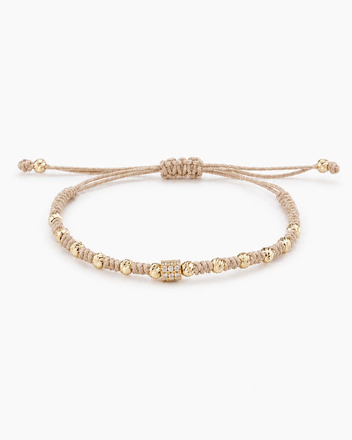 Beaded bracelet with gold accents on a white background #Color_Nude