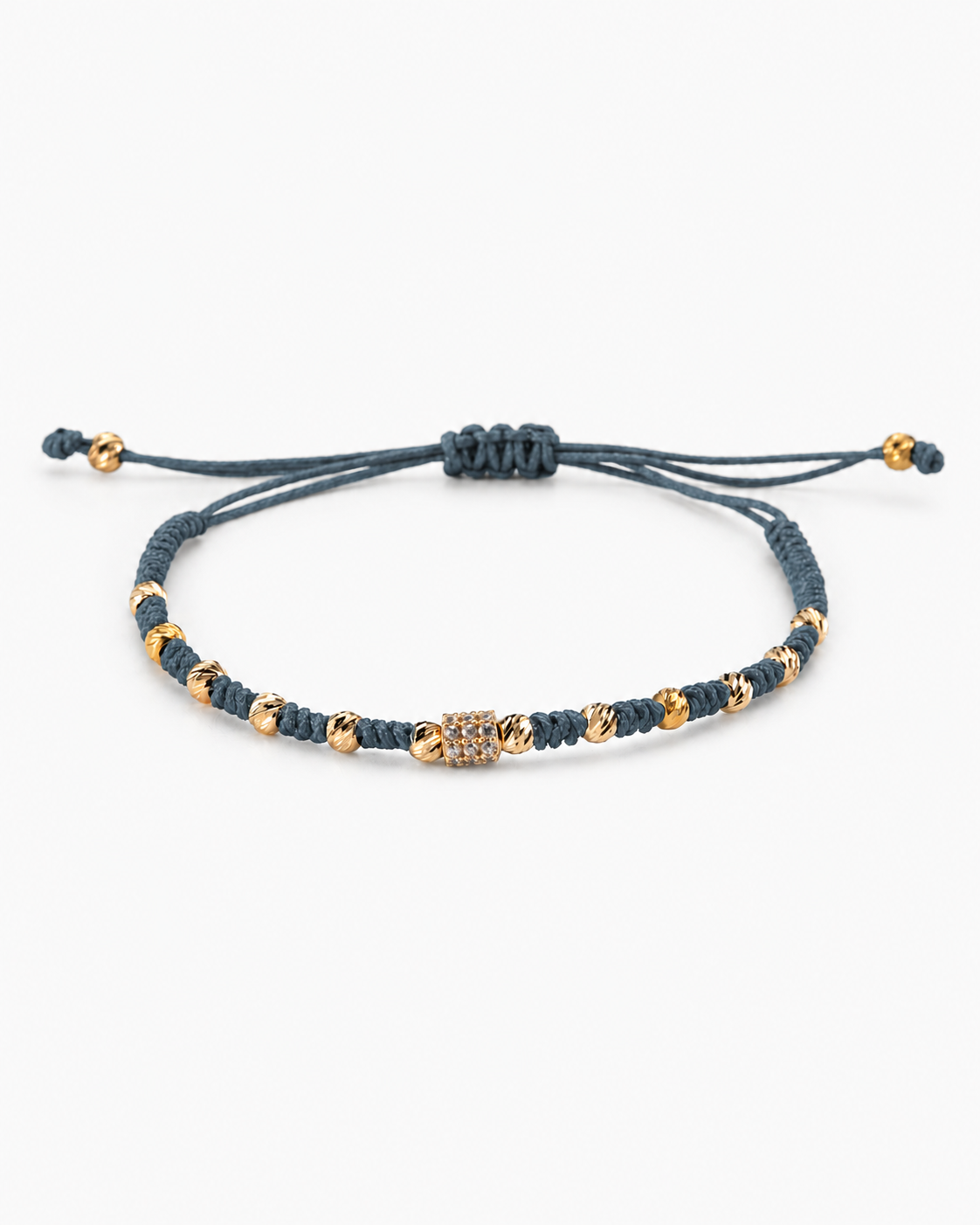 Navy blue beaded bracelet with gold accents on a white background #Color_Petrol Blue