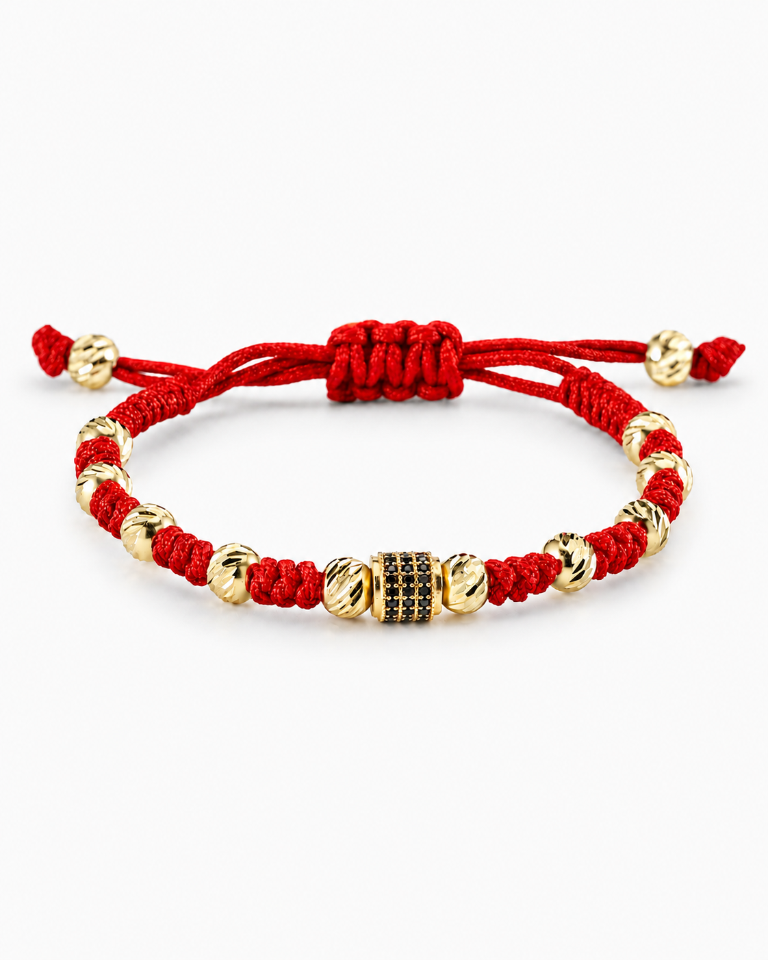 Red bracelet with gold beads on a white background