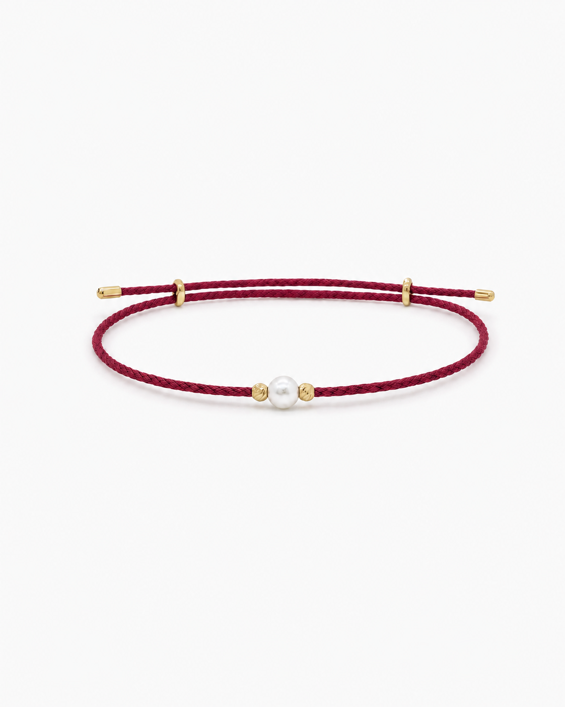 Red cord bracelet with gold beads and a pearl on a white background #Color_