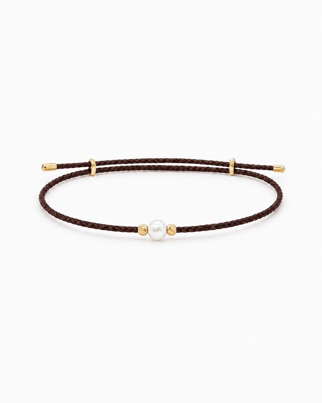 Brown cord bracelet with gold accents and a pearl on a white background