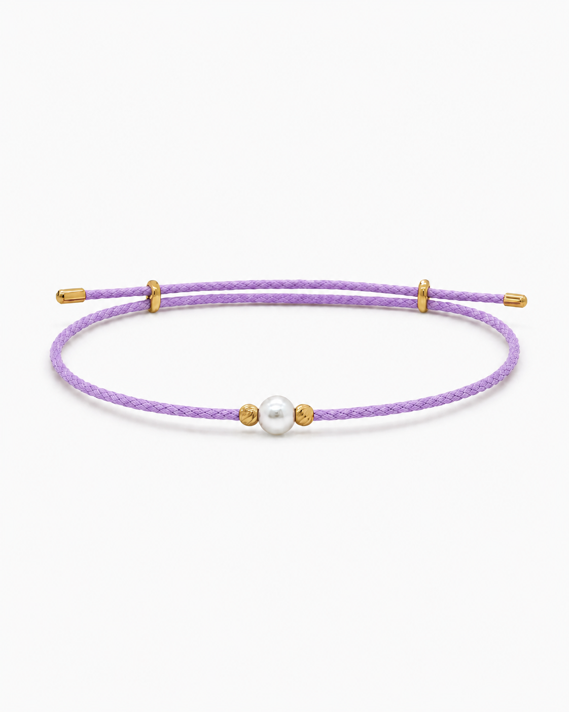 Purple bracelet with a pearl and gold accents on a white background #Color_