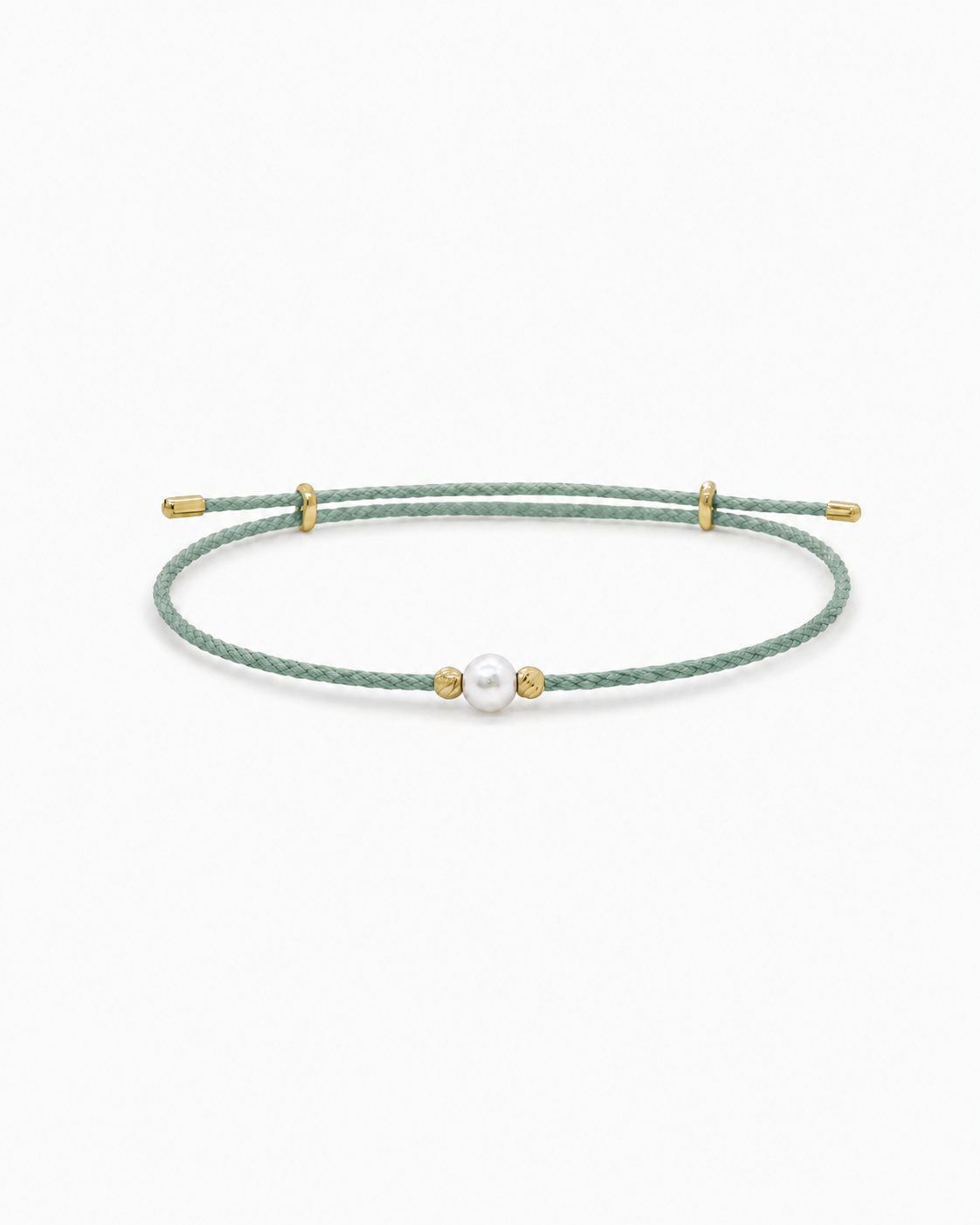 Green bracelet with a pearl and gold accents on a white background #Color_