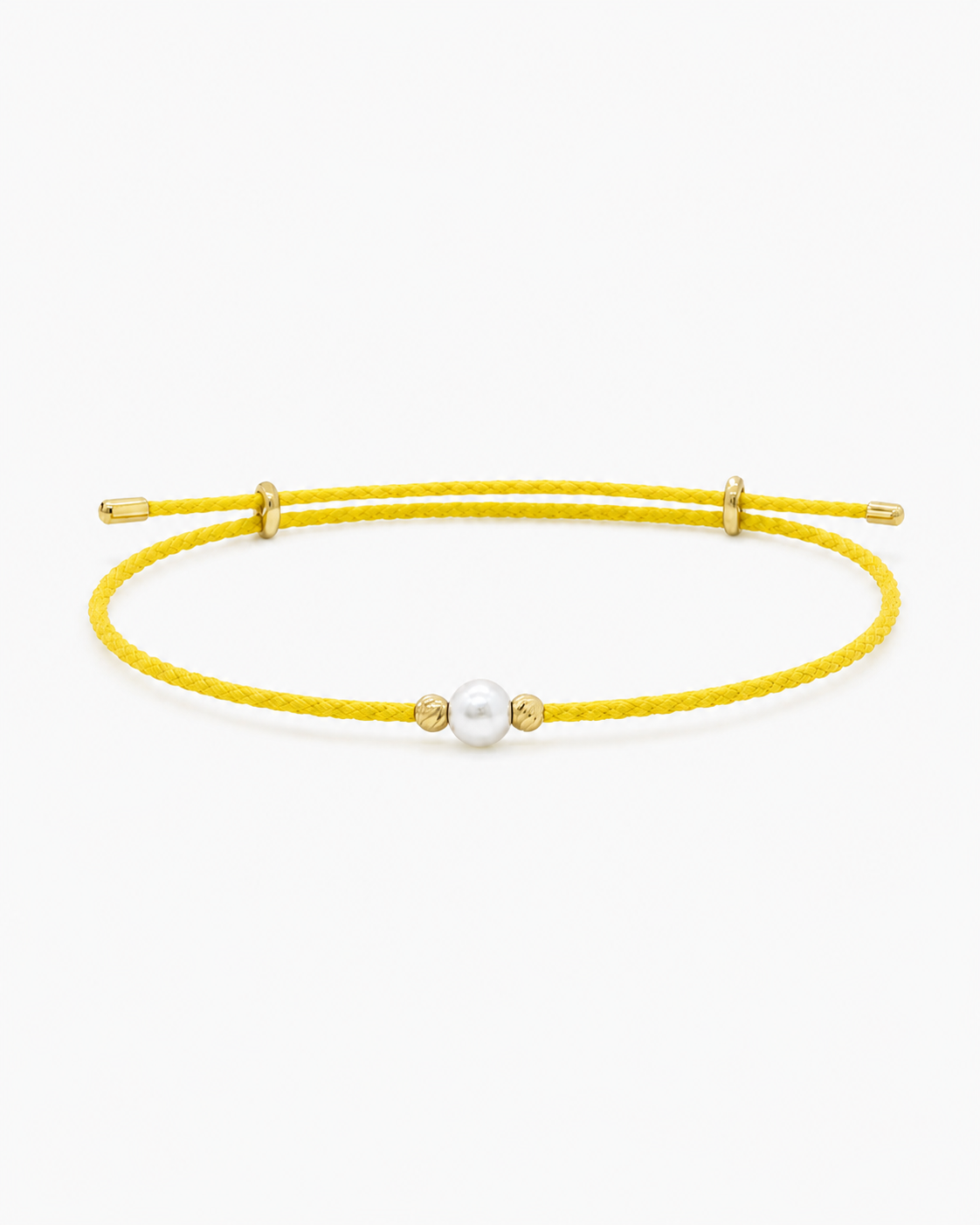 Yellow bracelet with a pearl bead on a white background #Color_