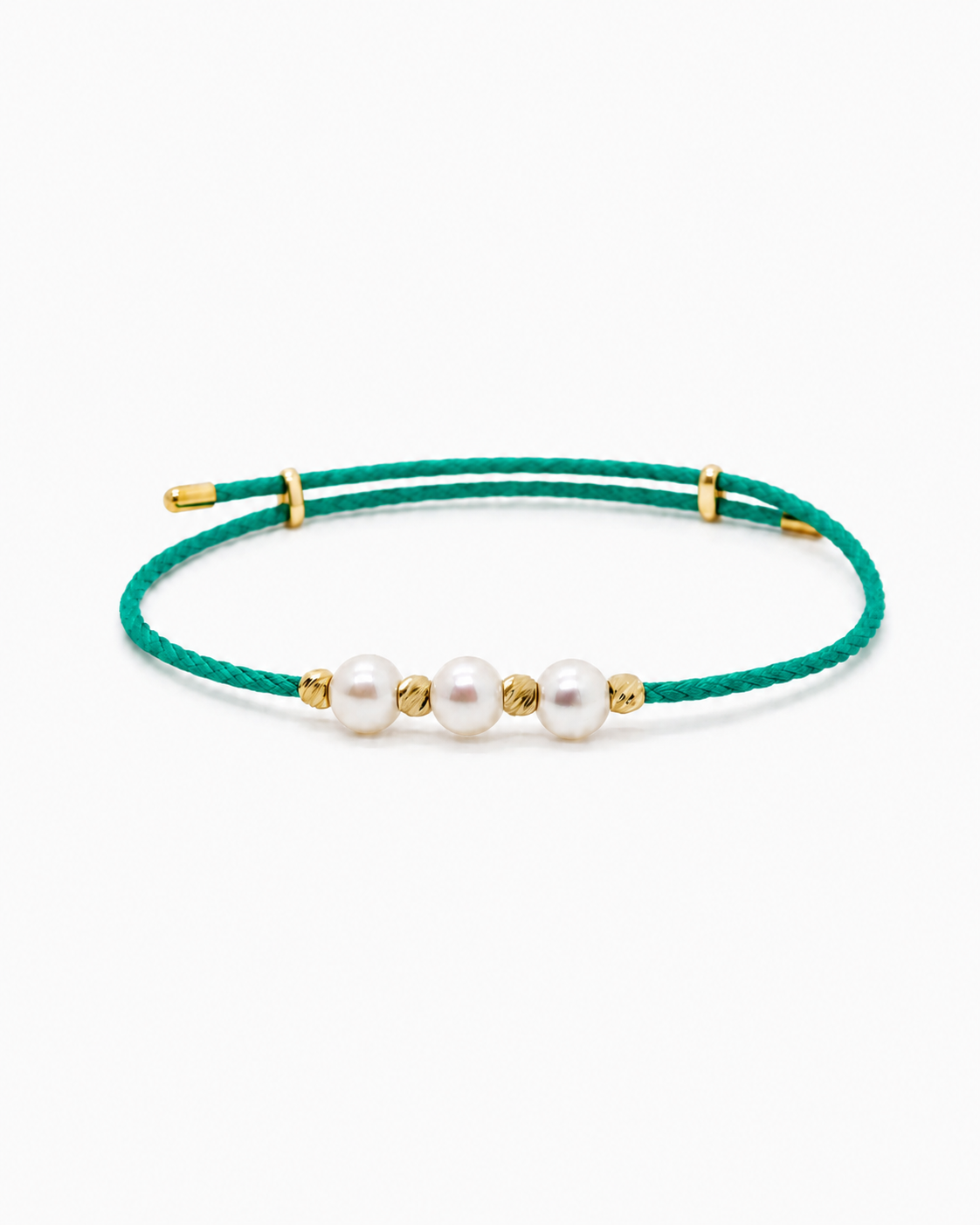 Green bracelet with pearls and gold accents on a white background #Color_Green