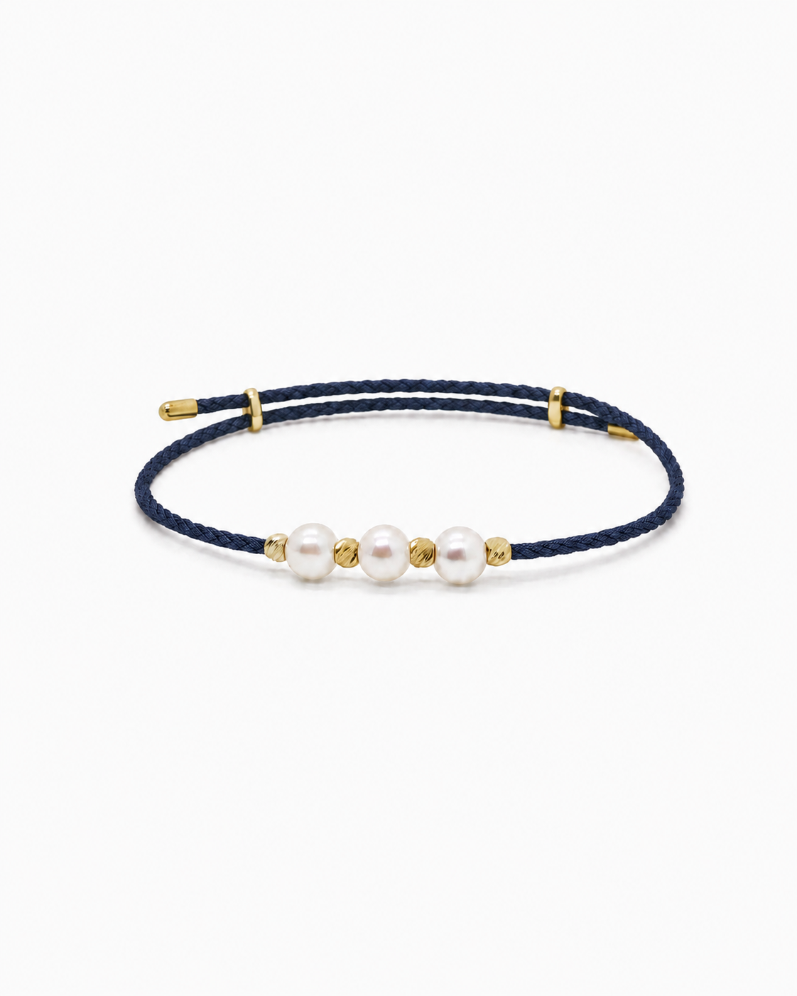Navy blue bracelet with gold accents and three pearls on a white background #Color_Navy