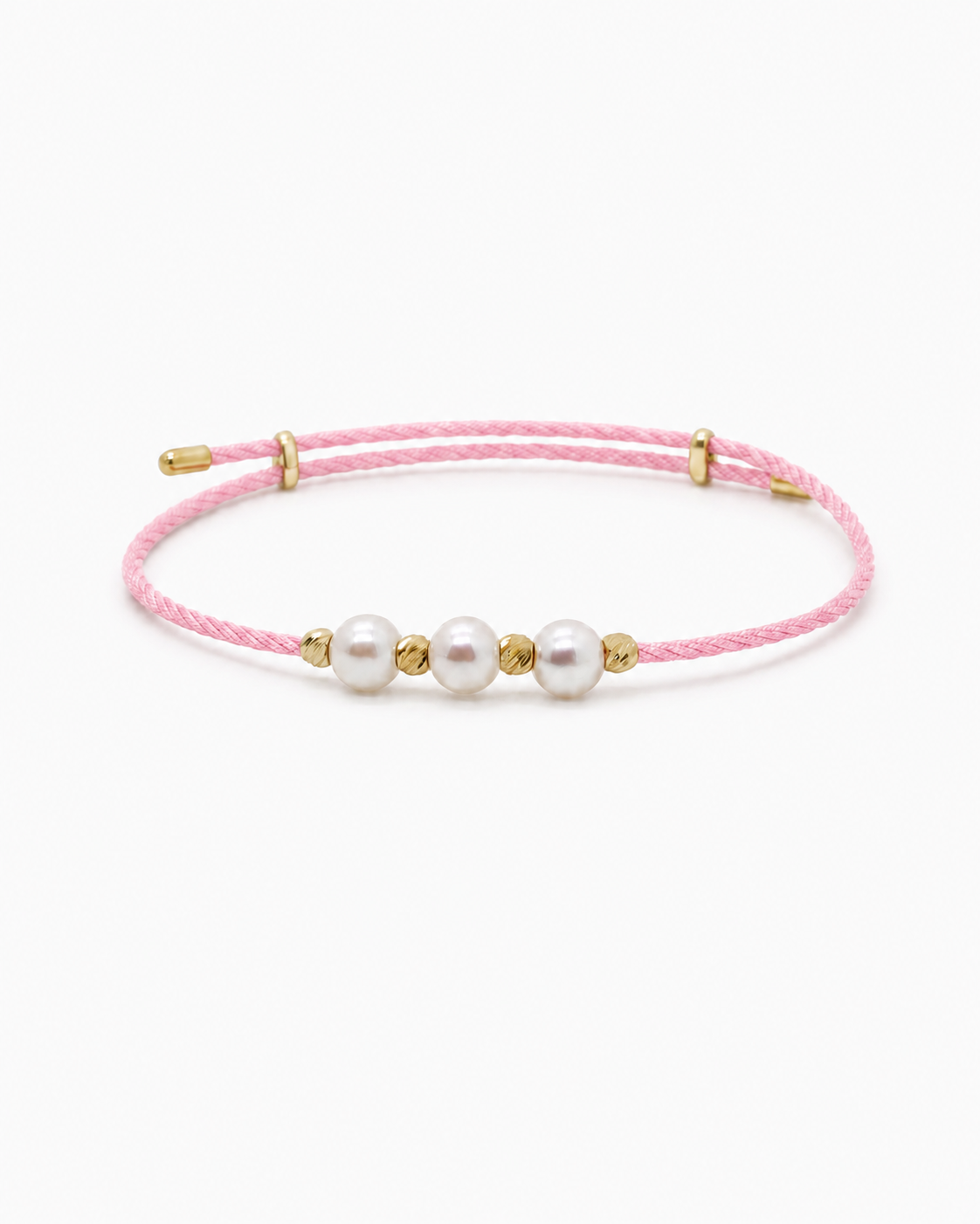 Pink bracelet with three pearls and gold accents on a white background #Color_Pink