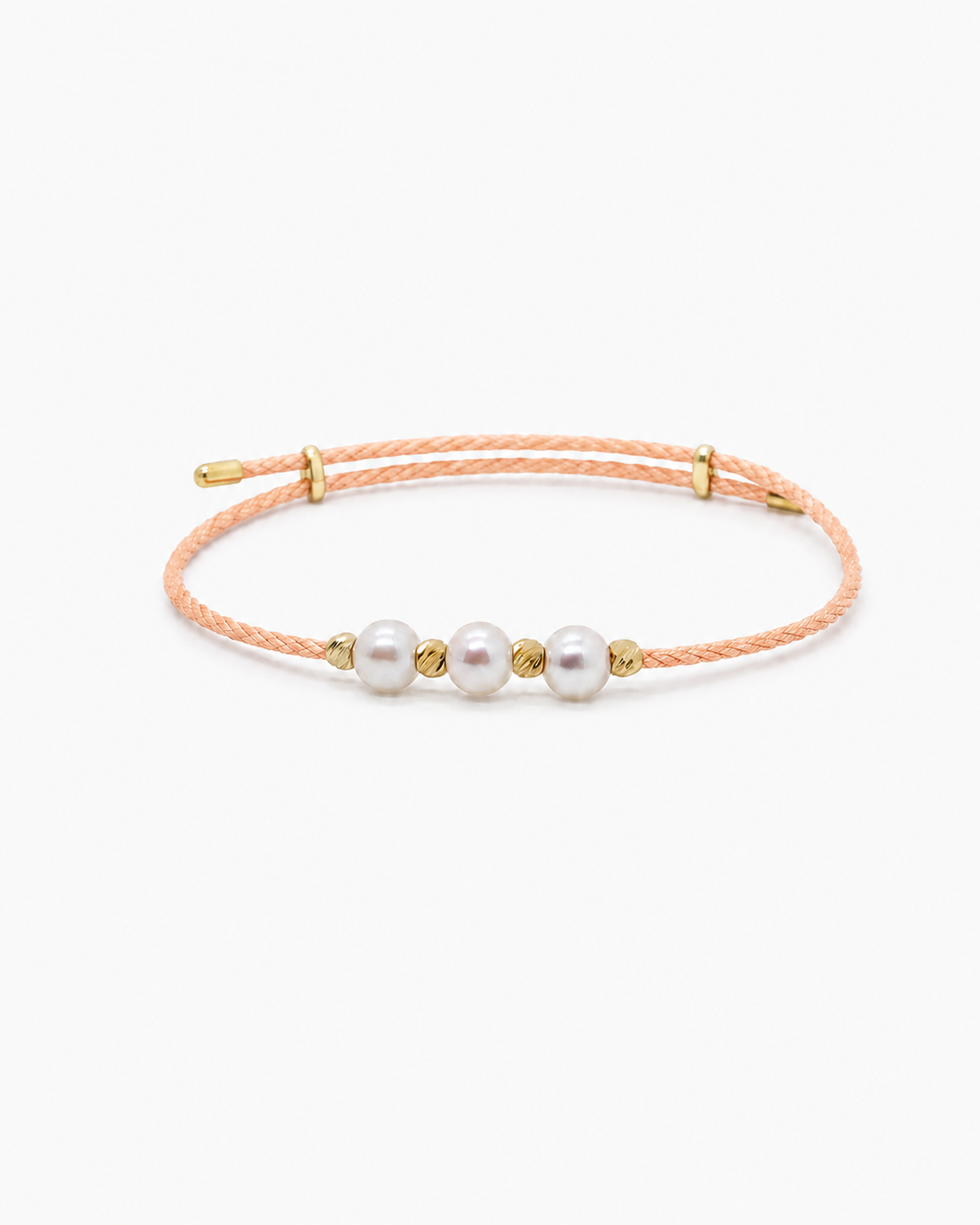 Bracelet with three pearls on a thin cord against a white background #Color_