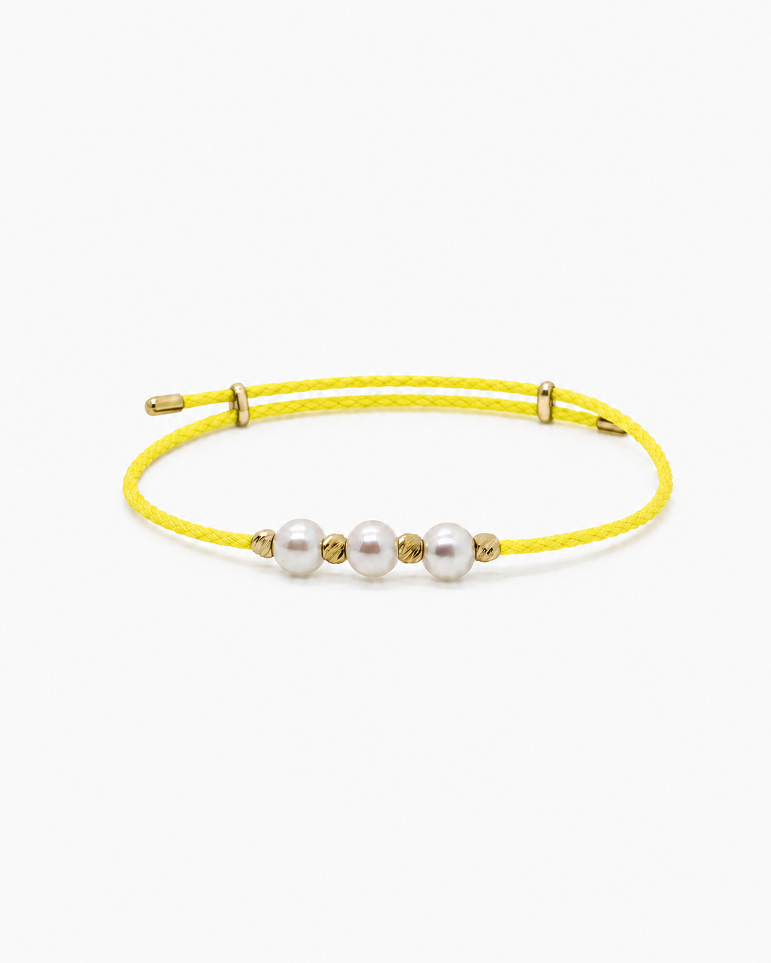 Yellow bracelet with pearls and gold accents on a white background #Color_Yellow